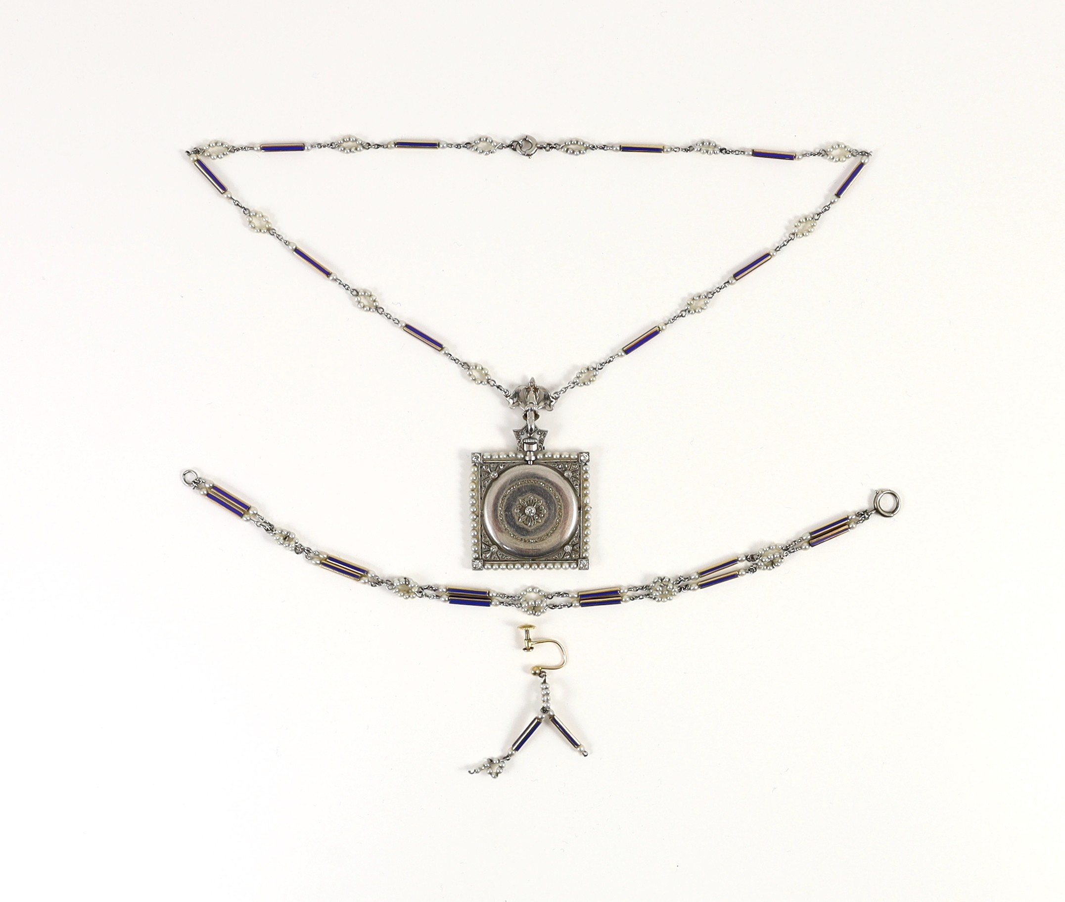 An early 20th century Tiffany & Co platinum, seed pearl and diamond set pendant square open faced dress timepiece, on a platinum, gold, enamel and seed pearl set chain, together with a matching 9ct bracelet and 9ct earri